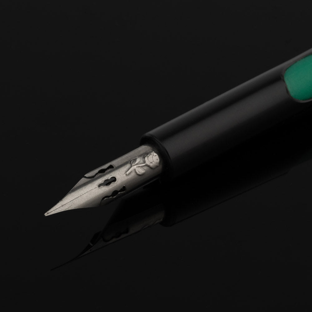 Brause Rose Nib Classic Pump Pen closeup on black background