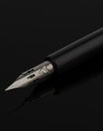 Brause Rose Nib Classic Pump Pen closeup on black background